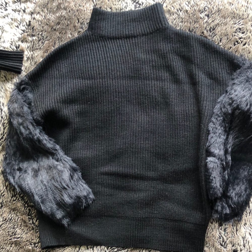 Black turtleneck sweater with faux fur sleeves